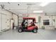 Attached garage with golf cart and storage space at 15692 Sw 11Th Court Rd, Ocala, FL 34473