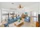 Open concept living room with comfortable seating and access to kitchen at 15692 Sw 11Th Court Rd, Ocala, FL 34473