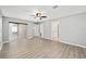 Spacious main bedroom with wood-look floors and access to the bathroom at 15692 Sw 11Th Court Rd, Ocala, FL 34473
