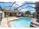Inviting screened pool and hot tub with a spacious patio at 15692 Sw 11Th Court Rd, Ocala, FL 34473