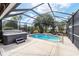 Relaxing screened pool and jacuzzi with waterfall feature at 15692 Sw 11Th Court Rd, Ocala, FL 34473