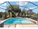 Refreshing screened pool with tiled water feature at 15692 Sw 11Th Court Rd, Ocala, FL 34473