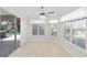 Sunroom features tile floors, multiple windows, and access to the pool area at 15692 Sw 11Th Court Rd, Ocala, FL 34473