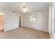 Bright bedroom with ceiling fan, carpet, and ample closet space at 1616 San Diego St, The Villages, FL 32159