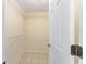 Walk-in closet with wire shelving for ample storage at 1616 San Diego St, The Villages, FL 32159