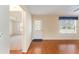 Hardwood floor entryway with view into living room and front door at 1616 San Diego St, The Villages, FL 32159