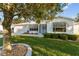 Front view of a single story home with landscaping at 1616 San Diego St, The Villages, FL 32159