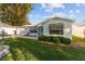 Single story house with a well-maintained lawn at 1616 San Diego St, The Villages, FL 32159