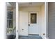 Inviting front entrance with a white door and glass accents at 1616 San Diego St, The Villages, FL 32159