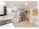 Bright kitchen features stainless steel appliances and light wood cabinets at 1616 San Diego St, The Villages, FL 32159