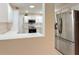 Well-equipped kitchen with stainless steel appliances and white cabinets at 1616 San Diego St, The Villages, FL 32159