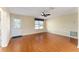 Hardwood floor living room with front door and window at 1616 San Diego St, The Villages, FL 32159