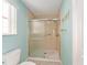 Updated walk-in shower with grab bars and modern fixtures at 1616 San Diego St, The Villages, FL 32159