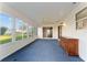 Sunroom with sliding doors leading to the backyard at 1616 San Diego St, The Villages, FL 32159