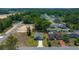 Aerial view of a home with a private yard in a tranquil neighborhood surrounded by lush greenery and scenic views at 1664 Sw 167Th St, Ocala, FL 34473