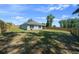 View of a spacious backyard enclosed with a wooden fence, offering privacy and ample outdoor space at 1664 Sw 167Th St, Ocala, FL 34473
