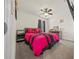 Bright bedroom with a queen bed, ceiling fan and dresser at 1664 Sw 167Th St, Ocala, FL 34473