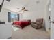 Comfortable bedroom with a king-size bed and relaxing chair at 1664 Sw 167Th St, Ocala, FL 34473