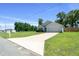 Lovely single-story house with a long driveway, well-kept lawn, and attached two-car garage at 1664 Sw 167Th St, Ocala, FL 34473