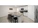 Modern kitchen features white cabinets, stainless steel appliances, and an island with granite countertop at 1664 Sw 167Th St, Ocala, FL 34473