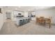 Open kitchen with island, stainless steel appliances, and dining area at 1664 Sw 167Th St, Ocala, FL 34473