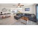 Spacious living room with L-shaped sectional sofa and view of kitchen at 1664 Sw 167Th St, Ocala, FL 34473