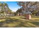 Charming pink house with expansive lawn and mature trees at 1670 Se 169Th Terrace Rd, Silver Springs, FL 34488