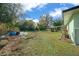 Large backyard with shed and mature landscaping at 2004 Ne 52Nd St, Ocala, FL 34479