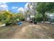 Backyard with shed, lawn, and various garden features at 2004 Ne 52Nd St, Ocala, FL 34479