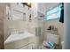 Clean bathroom with a single sink vanity, shower, and toilet at 2004 Ne 52Nd St, Ocala, FL 34479