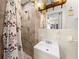 Bathroom with shower stall, vanity sink, and tiled walls at 2004 Ne 52Nd St, Ocala, FL 34479