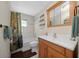 Clean bathroom with a shower/tub combo and wood vanity at 2004 Ne 52Nd St, Ocala, FL 34479