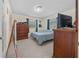 Bright bedroom featuring a double bed, dresser, and ample closet space at 2004 Ne 52Nd St, Ocala, FL 34479