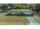 Charming ranch home with a green exterior and a spacious yard at 2004 Ne 52Nd St, Ocala, FL 34479