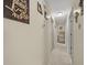 Long hallway with light walls and tile flooring at 2004 Ne 52Nd St, Ocala, FL 34479