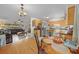 Open concept kitchen with wood cabinets and a dining area at 2004 Ne 52Nd St, Ocala, FL 34479