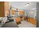 Kitchen with wood cabinets, stainless steel appliances, and tile floors at 2004 Ne 52Nd St, Ocala, FL 34479