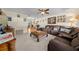 Living room with brown sectional sofa and wood coffee table at 2004 Ne 52Nd St, Ocala, FL 34479