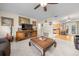 Bright living room featuring hardwood floors, a large sectional sofa, and a coffee table at 2004 Ne 52Nd St, Ocala, FL 34479