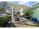 Covered patio with seating area, perfect for outdoor relaxation at 2004 Ne 52Nd St, Ocala, FL 34479