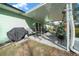 Covered patio with space for grilling and outdoor fitness at 2004 Ne 52Nd St, Ocala, FL 34479