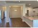 Spacious kitchen and dining area with wood floors and a stylish chandelier at 2142 Nw 23Rd Loop, Ocala, FL 34475