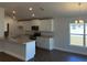 Modern kitchen with white cabinets, stainless steel appliances, and a granite countertop island at 2142 Nw 23Rd Loop, Ocala, FL 34475