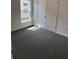 A bright bedroom with a window allowing light to flood in and a spacious closet with white paneled doors at 2146 Nw 23Rd Loop, Ocala, FL 34475