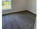 Cozy bedroom with plush carpeting, neutral walls, and a window view at 2146 Nw 23Rd Loop, Ocala, FL 34475