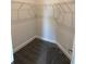 A walk-in closet with durable carpeting and a built-in wire shelving system providing ample storage solutions at 2146 Nw 23Rd Loop, Ocala, FL 34475