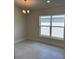 Dining room featuring ceramic tile floors, neutral walls, and a window view at 2146 Nw 23Rd Loop, Ocala, FL 34475