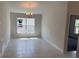 Dining room featuring ceramic tile floors, neutral walls, and a window view at 2146 Nw 23Rd Loop, Ocala, FL 34475
