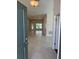 Welcoming entryway leads into an open-concept living space with ceramic tile flooring at 2146 Nw 23Rd Loop, Ocala, FL 34475