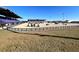 Outdoor equestrian arena featuring stadium seating, well-maintained grounds, and an obstacle course at 2146 Nw 23Rd Loop, Ocala, FL 34475